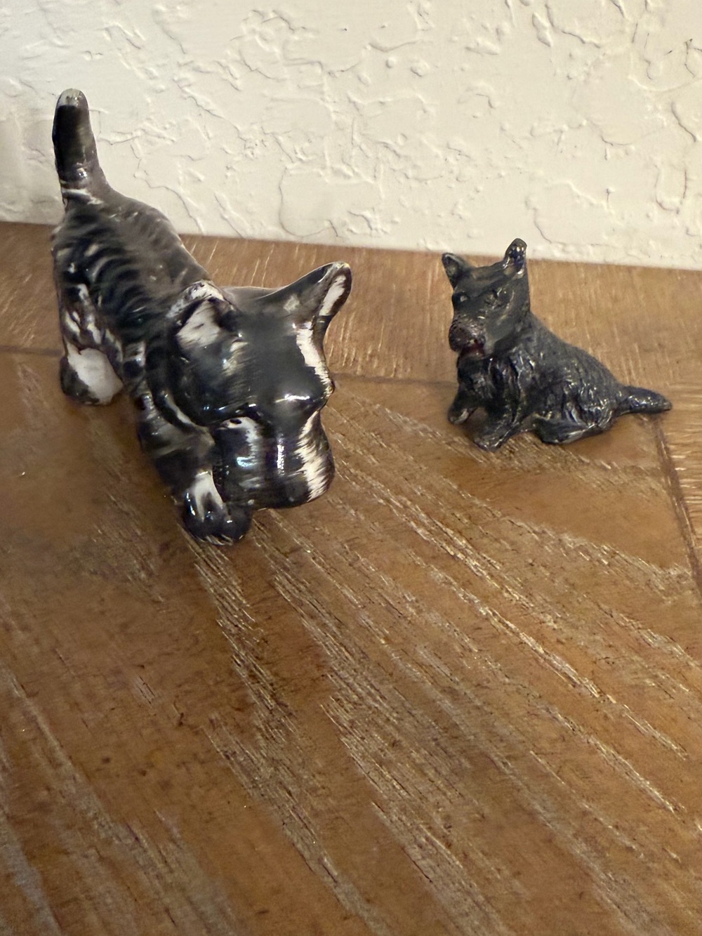 Black vintage Scottie dog figurines one cast iron and one Japanese